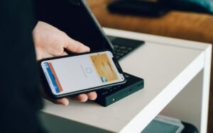 Illustrative photo of a mobile payment using a phone; not an image of the South Korean regulator's decision