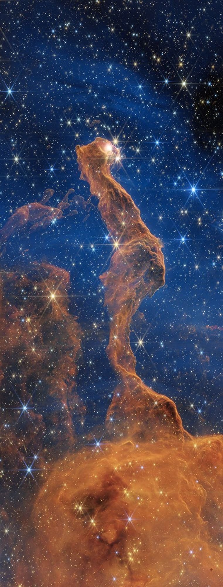 Infrared image of the Cat's Head Nebula, showing a dust column and many stars, captured by the James Webb Space Telescope; NASA, ESA, CSA, STScI