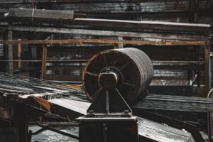A machine processes metal in an industrial workshop, an illustrative photograph