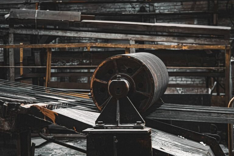 A machine processes metal in an industrial workshop, an illustrative photograph