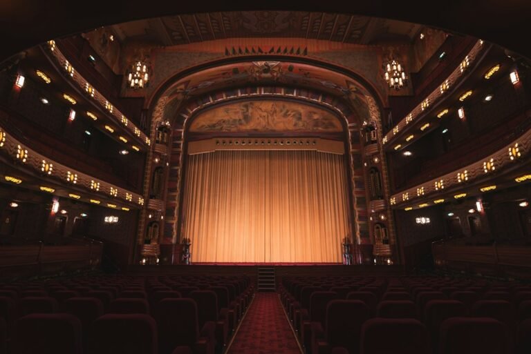 Empty theatre auditorium with stage and seating; illustrative image, not the production The Divine Comedy in Veliko Tarnovo. Photo: Liam McGarry / Unsplash